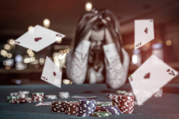 Upset woman in casino with falling cards